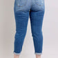 Judy Blue Plus Size Button Fly Distressed Jeans with Pockets, showcasing stylish back view and rolled hems.