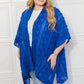 JUSTIN TAYLOR Pom-Pom Asymmetrical Poncho Cardigan in Blue at Bella Road