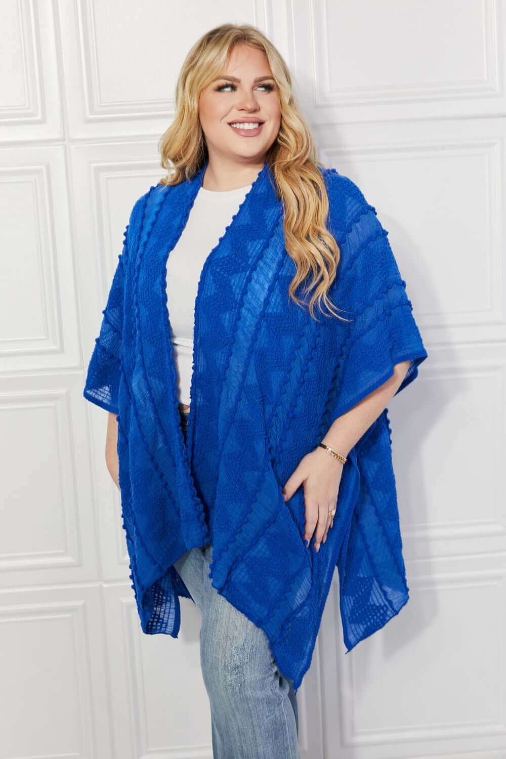 JUSTIN TAYLOR Pom-Pom Asymmetrical Poncho Cardigan in Blue at Bella Road