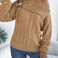 Woman wearing Bella Road Cable-Knit One Shoulder Long Sleeve Sweater in beige, paired with jeans, showcasing cozy and stylish design.