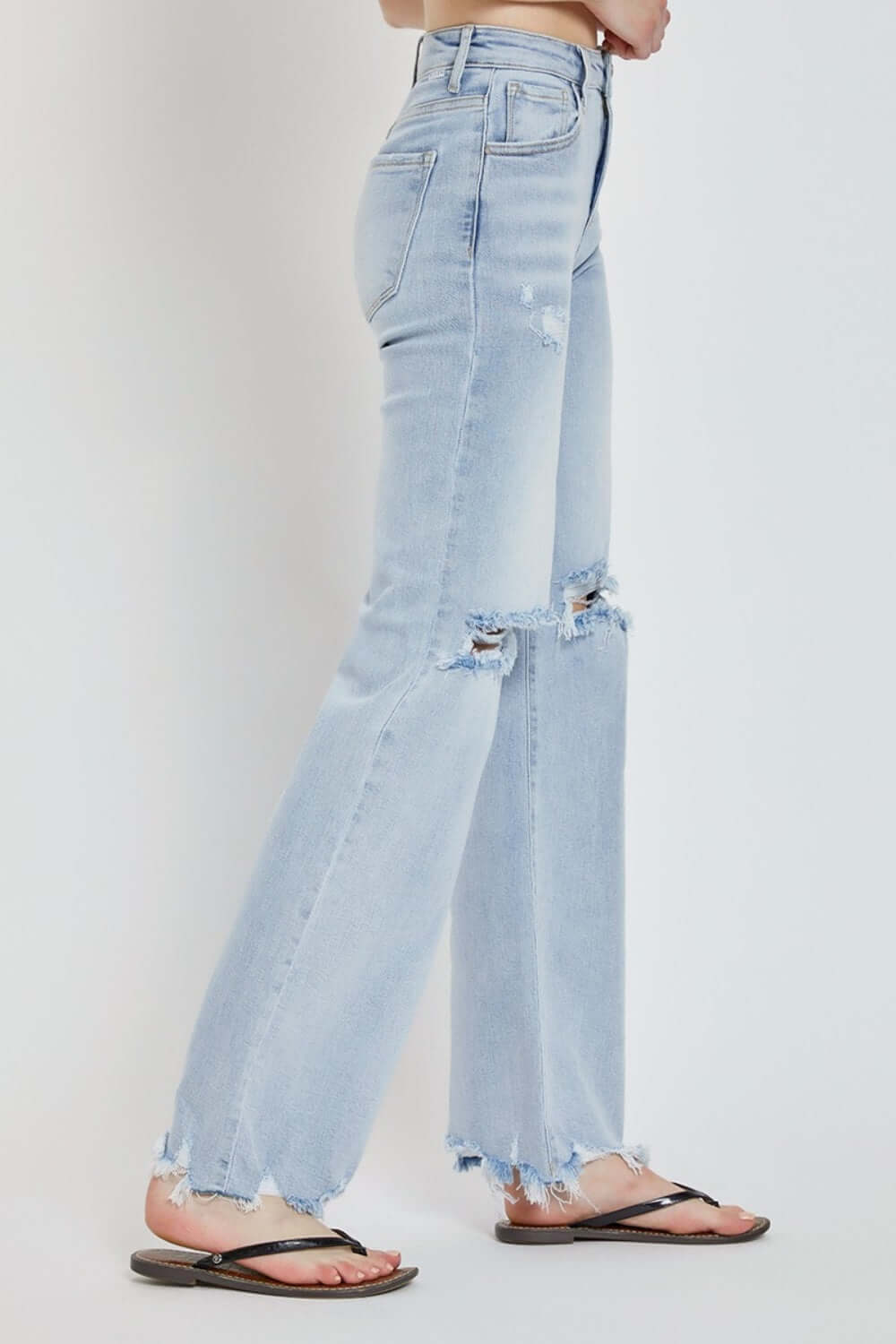 High rise distressed wide leg jeans by Risen Jeans, featuring trendy shredded details and a chic silhouette, perfect for stylish outfits.