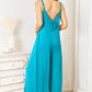 DOUBLE TAKE Full Size Soft Rayon Spaghetti Strap Tied Wide Leg Jumpsuit at Bella Road