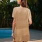 Woman in openwork short sleeve cover-up by pool, showcasing stylish beach attire with a trendy sheer design.