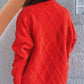 Woman wearing Bella Road Diamond Round Neck Long Sleeve Sweater in red, showcasing the diamond pattern back design.