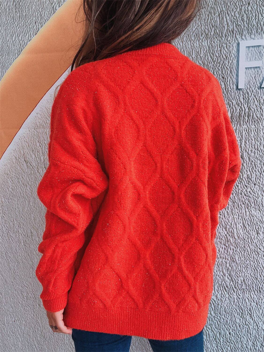 Woman wearing Bella Road Diamond Round Neck Long Sleeve Sweater in red, showcasing the diamond pattern back design.