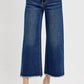 Wide leg raw hem jeans with attached buckle details, perfect for a trendy and relaxed look.