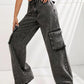 Woman modeling Bella Road wide leg jeans with pockets in dark grey, made from 85% cotton and 15% polyester, no stretch.