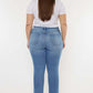 Woman wearing Cat's Whiskers High Waist Jeans, showcasing a flattering silhouette and vintage-inspired detailing from the back.