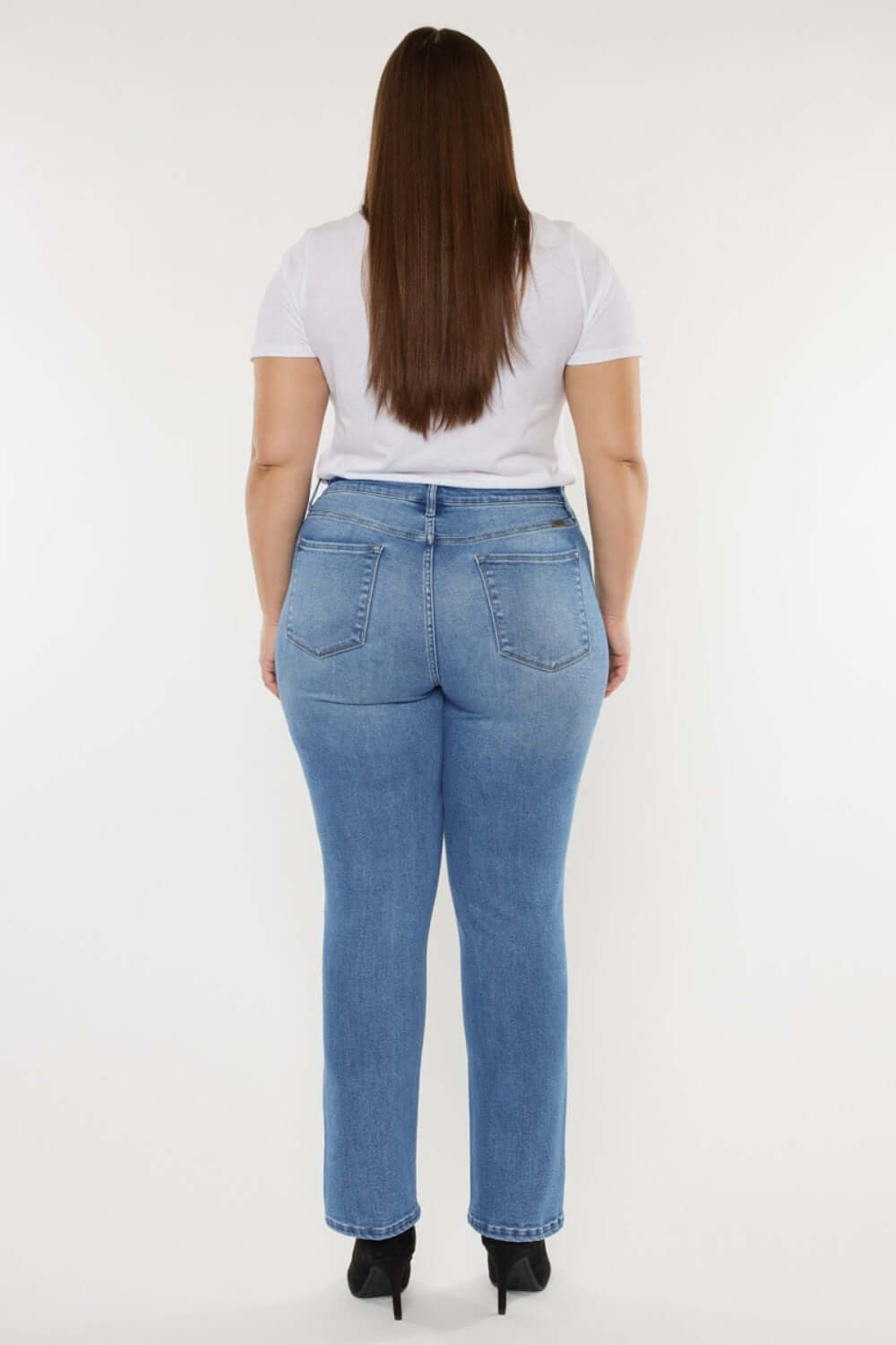 Woman wearing Cat's Whiskers High Waist Jeans, showcasing a flattering silhouette and vintage-inspired detailing from the back.