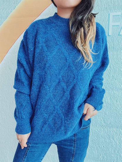 Woman wearing Bella Road Diamond Round Neck Long Sleeve Sweater in blue with jeans