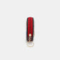 Side view of Nicole Lee USA keychain round coin purse with red zipper, perfect for organizing coins and keys stylishly.