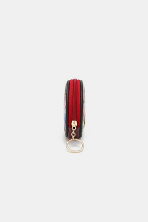 Side view of Nicole Lee USA keychain round coin purse with red zipper, perfect for organizing coins and keys stylishly.