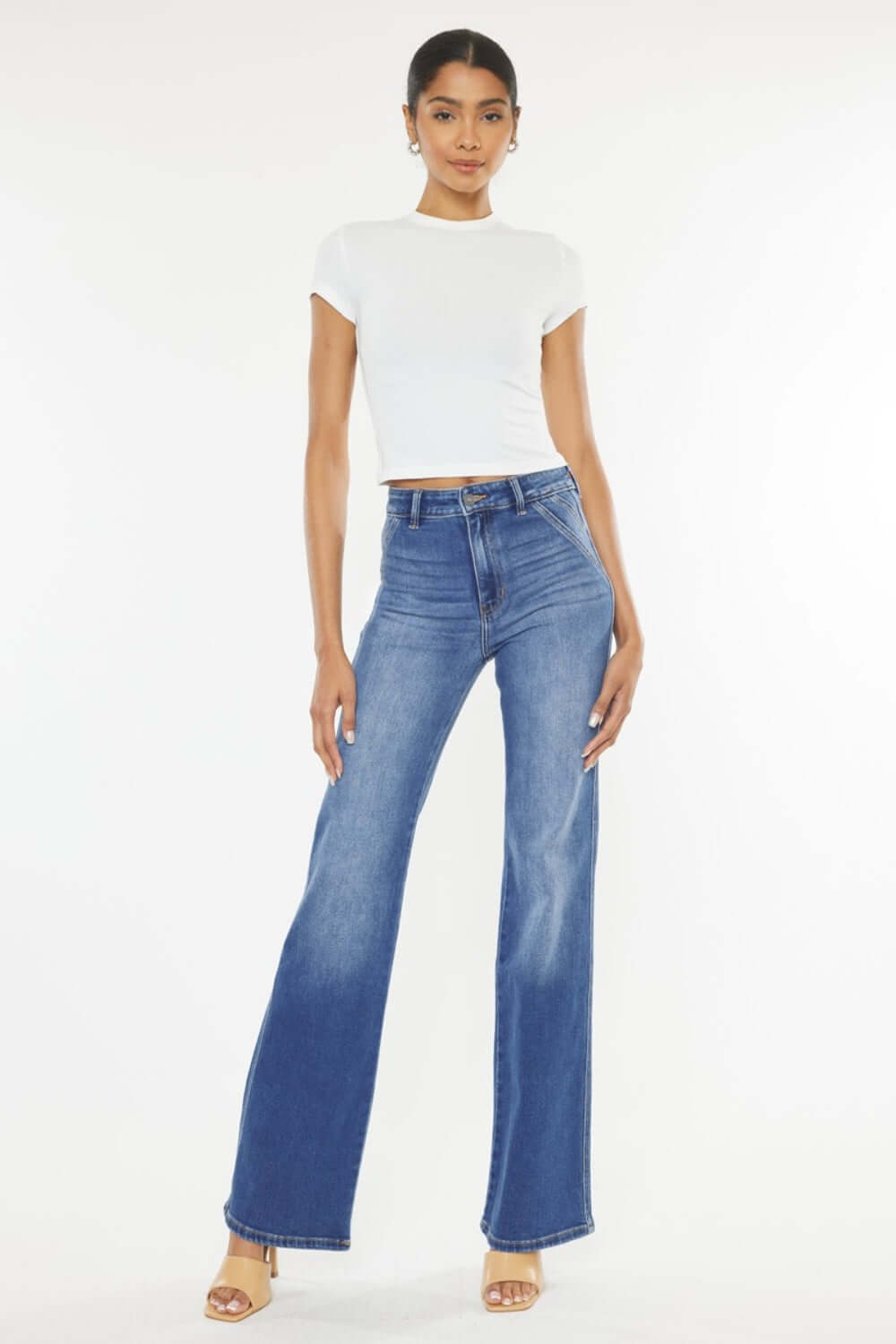 Model wearing Ultra High Waist Gradient Flare Jeans with a white top, showcasing a bold, fashion-forward denim look with a flattering silhouette.