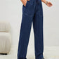 Woman wearing Bella Road Drawstring Elastic Waist Jeans with Pockets, showcasing a comfortable and stylish look.