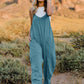 DOUBLE TAKE Full Size V-Neck Sleeveless Jumpsuit with Pockets at Bella Road