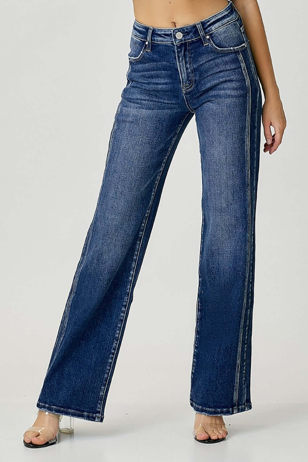 Mid Rise Straight Jeans in durable denim material, offering a flattering silhouette and sleek look. Perfect for everyday styling. Risen Jeans.