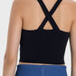 Back view of Millennia Crisscross Grecian Neck Active Cami in black, showcasing its stylish crisscross design.