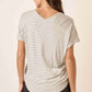 Back view of woman wearing Striped V-Neck Short Sleeve T-Shirt and black shorts, showcasing the stylish stripe pattern and comfortable fit.