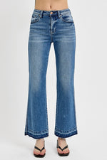 Trendy RISEN full size raw hem ankle bootcut jeans with a flattering fit and stylish blue denim wash. Perfect for any occasion!