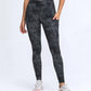 Millennia wide waistband leggings in black camo with pockets, perfect for workouts and casual wear.