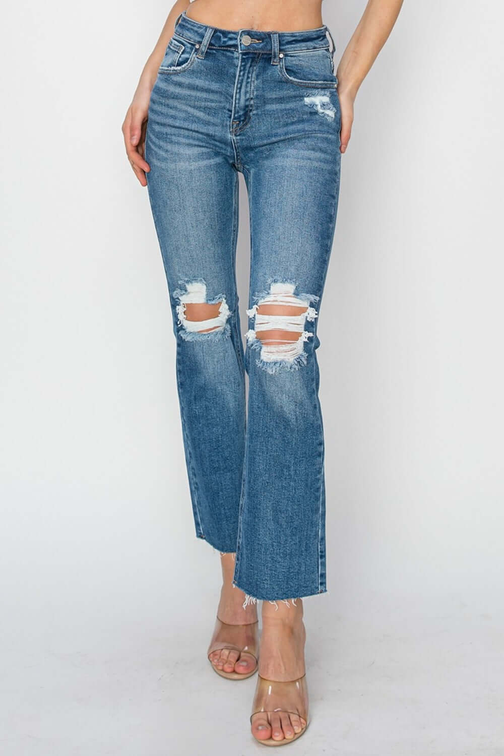 High Rise Distressed Ankle Jeans by Risen Jeans with trendy ripped detailing, perfect for versatile outfits.