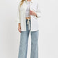 Model showcasing RISEN Full Size Straight Leg Jeans with Pockets, styled with a casual white shirt for a trendy look.