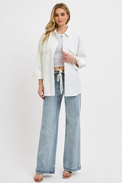 Model showcasing RISEN Full Size Straight Leg Jeans with Pockets, styled with a casual white shirt for a trendy look.