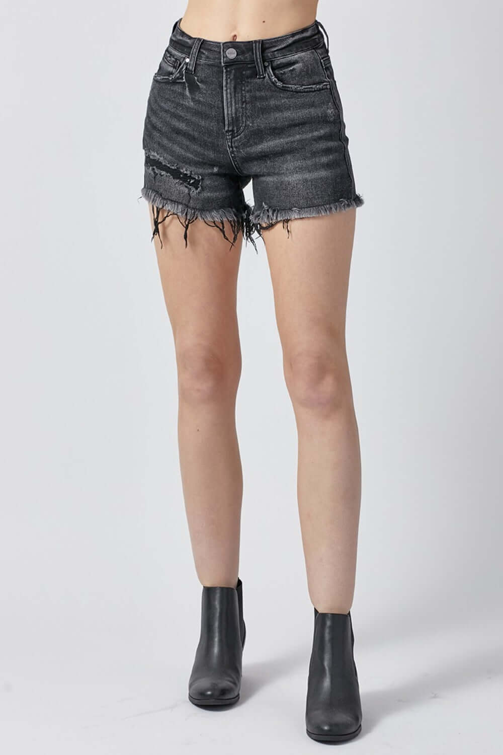 Raw hem denim shorts with pockets by Risen Jeans, perfect for versatile and casual summer styling, shown on a model.