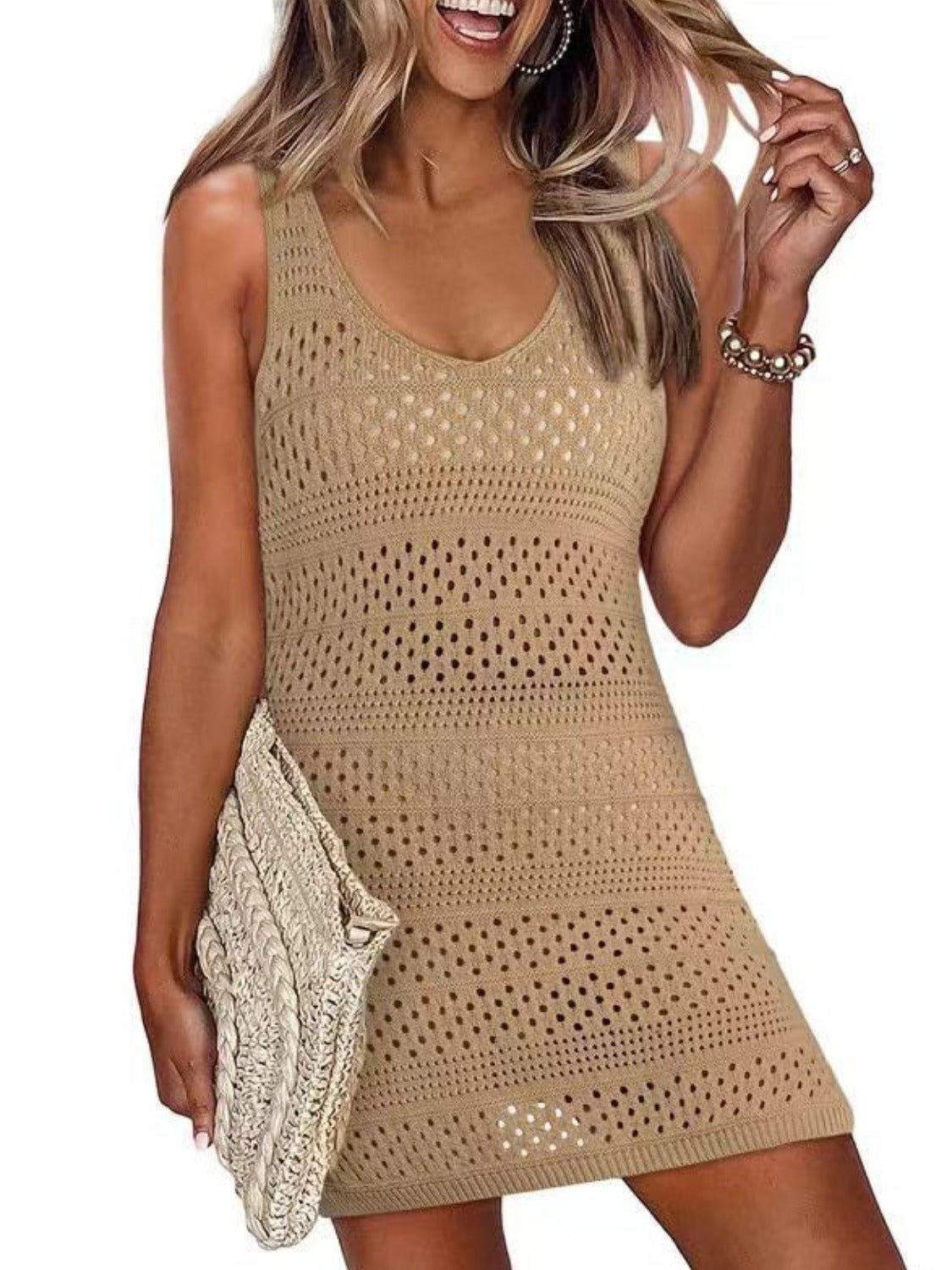 Stylish woman in a camel openwork scoop neck cover-up, perfect for playful beach days and sunny adventures.