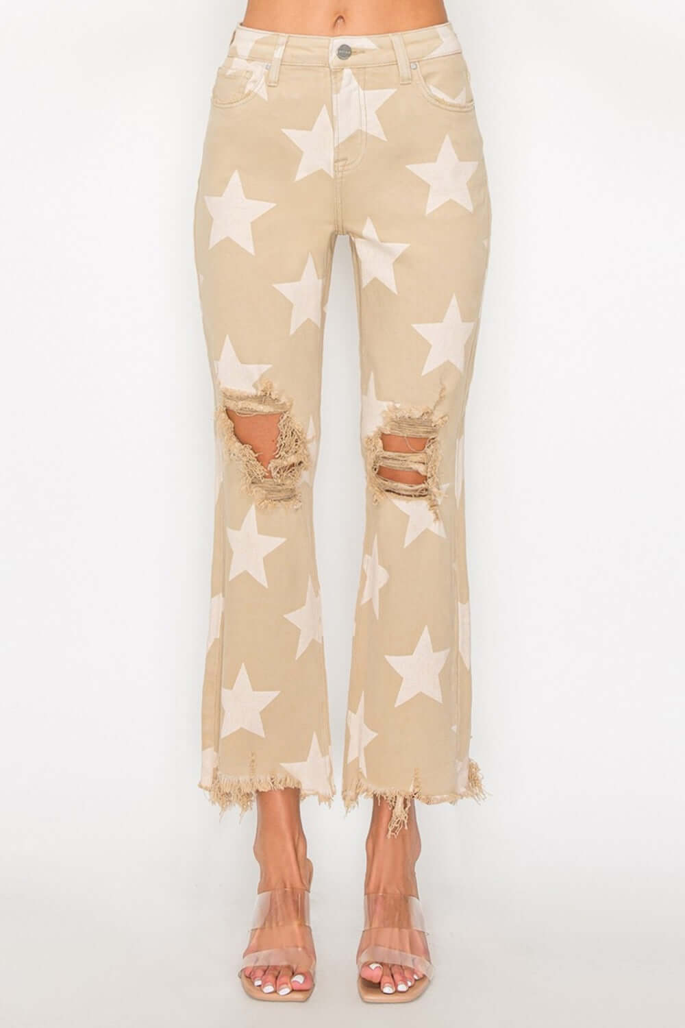 Stylish high rise jeans with star print and frayed hem, perfect for a trendy look with a fun and edgy touch.