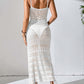 Woman wearing white semi-sheer openwork scoop neck cover-up dress with tassel details and slightly stretchy fit.