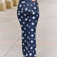 Person wearing Judy Blue Jeans - Janelle Full Size High Waist Star Print Flare Jeans in dark wash finish, viewed from the back.