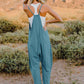 DOUBLE TAKE Full Size V-Neck Sleeveless Jumpsuit with Pockets at Bella Road