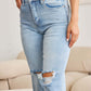 Woman wearing Tummy Control High Waist Raw Hem Distressed Jeans, showcasing the stylish distressed detailing and high waist fit. RFM Jeans.