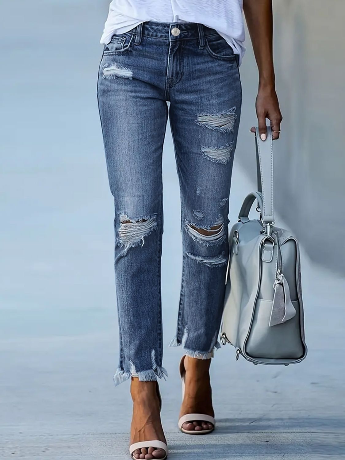 Bella Road Distressed Raw Hem Jeans with Pockets, edgy style, moderate stretch, perfect for a fashion-forward look.