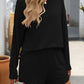 Woman wearing Double Take Round Neck Long Sleeve Top and Shorts Set in black, perfect for casual outings or lounging at home.