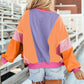 Bella Road Color Block Round Neck Long Sleeve Top on woman at outdoor stadium scene.