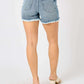 Back view of Button Fly Raw Hem Denim Shorts by Judy Blue Jeans showing high-quality denim and trendy raw hem detailing.