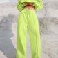 Lime Bella Road Set with round neck top and elastic waist pants, perfect for a trendy and comfortable look in any setting.