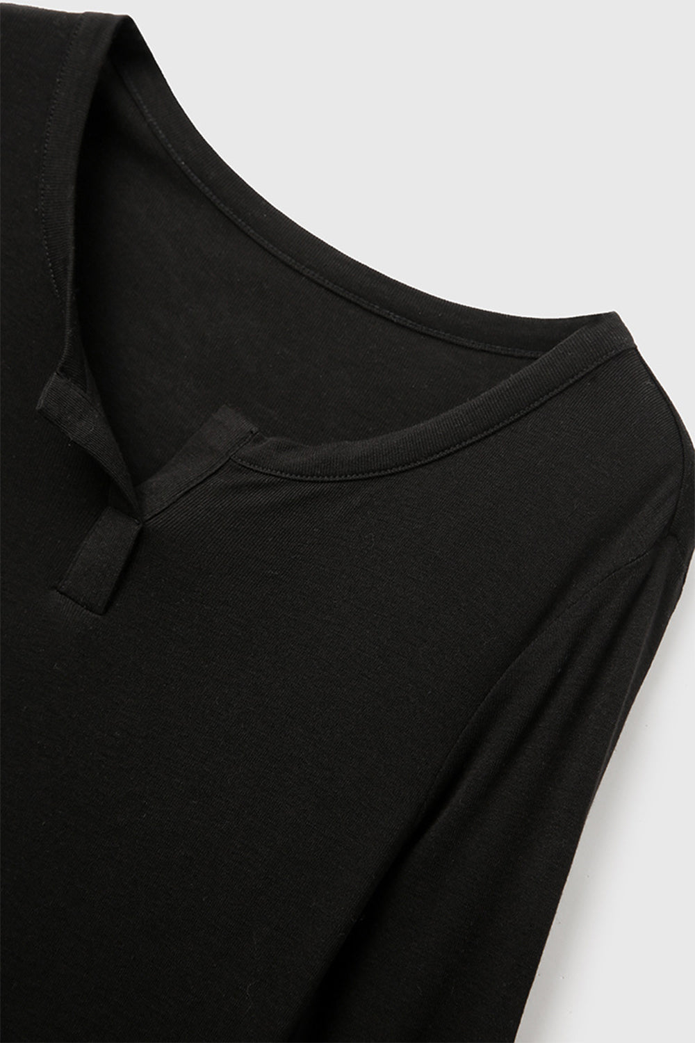 Basic Bae Notched Long Sleeve T-Shirt in black with unique neckline detail, perfect for casual or dressy occasions.