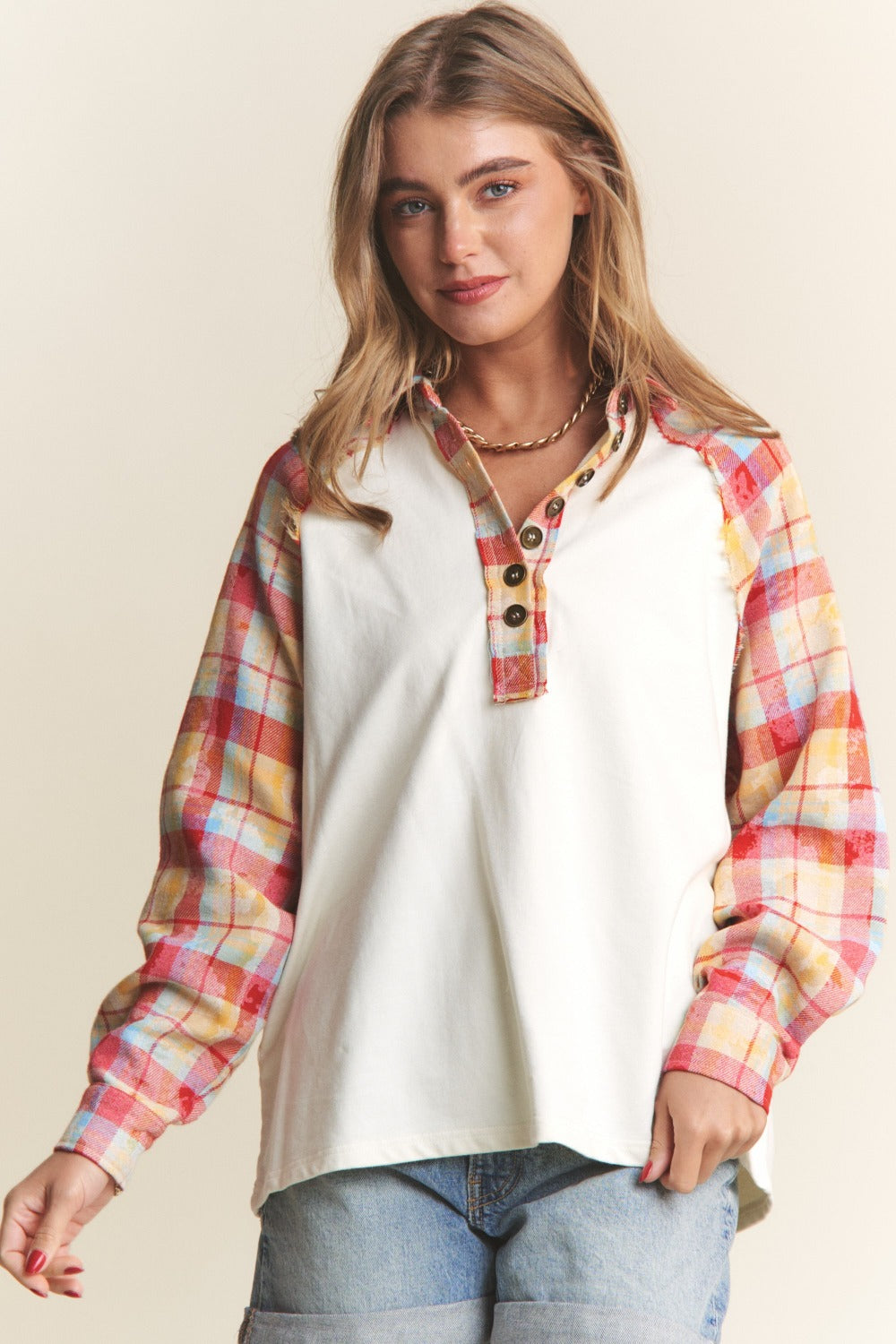 Woman in J.NNA Plaid Contrast Button Down Henley Top with jeans smiling stylishly