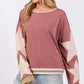 Chic French terry star applique patch sweatshirt, stylish design with exposed seams, perfect casual sophistication.