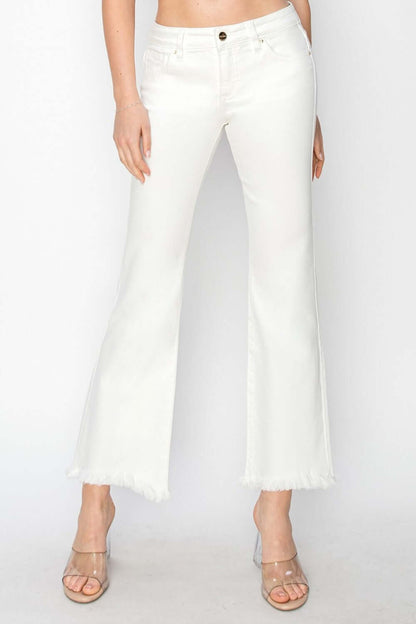 Full size white crop flare step hem pants with tummy control feature and raw hem detail. Perfect blend of comfort and style.