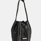 Nicole Lee USA Amy Studded Bucket Bag in black vegan leather with stud and zipper detailing, drawstring closure, and metal feet for durability.