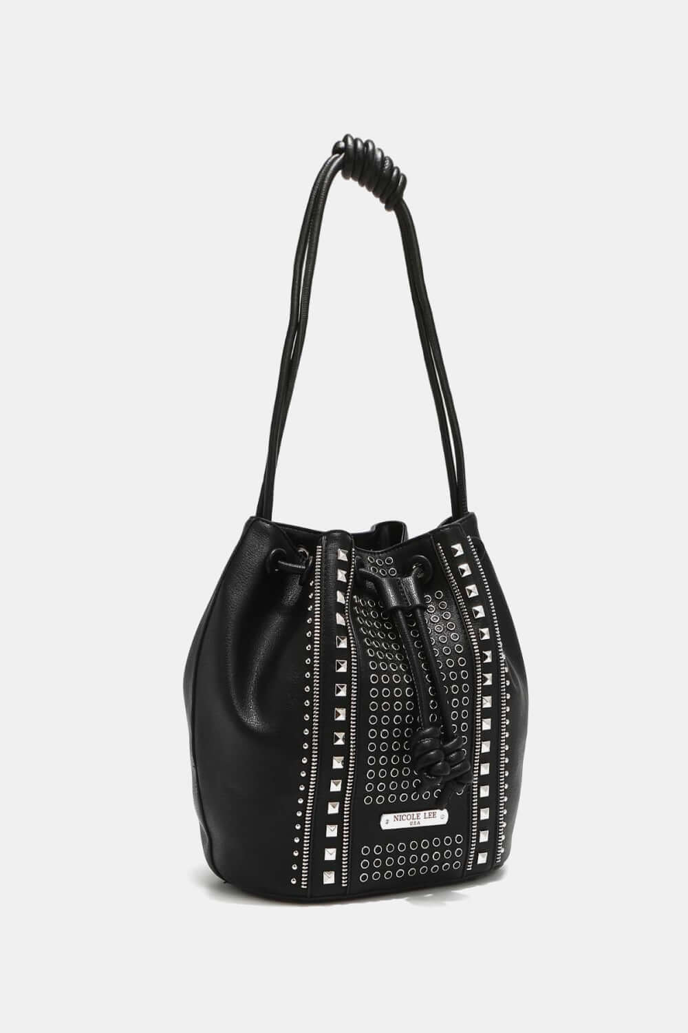 Nicole Lee USA Amy Studded Bucket Bag in black vegan leather with stud and zipper detailing, drawstring closure, and metal feet for durability.