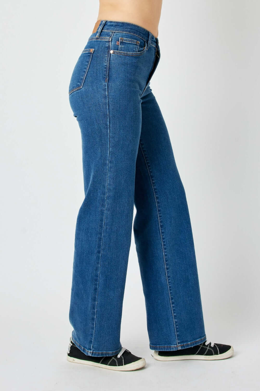 High rise straight Judy Blue Jeans with a flattering fit elongating the legs and accentuating the waist, perfect for casual or dressy tops.