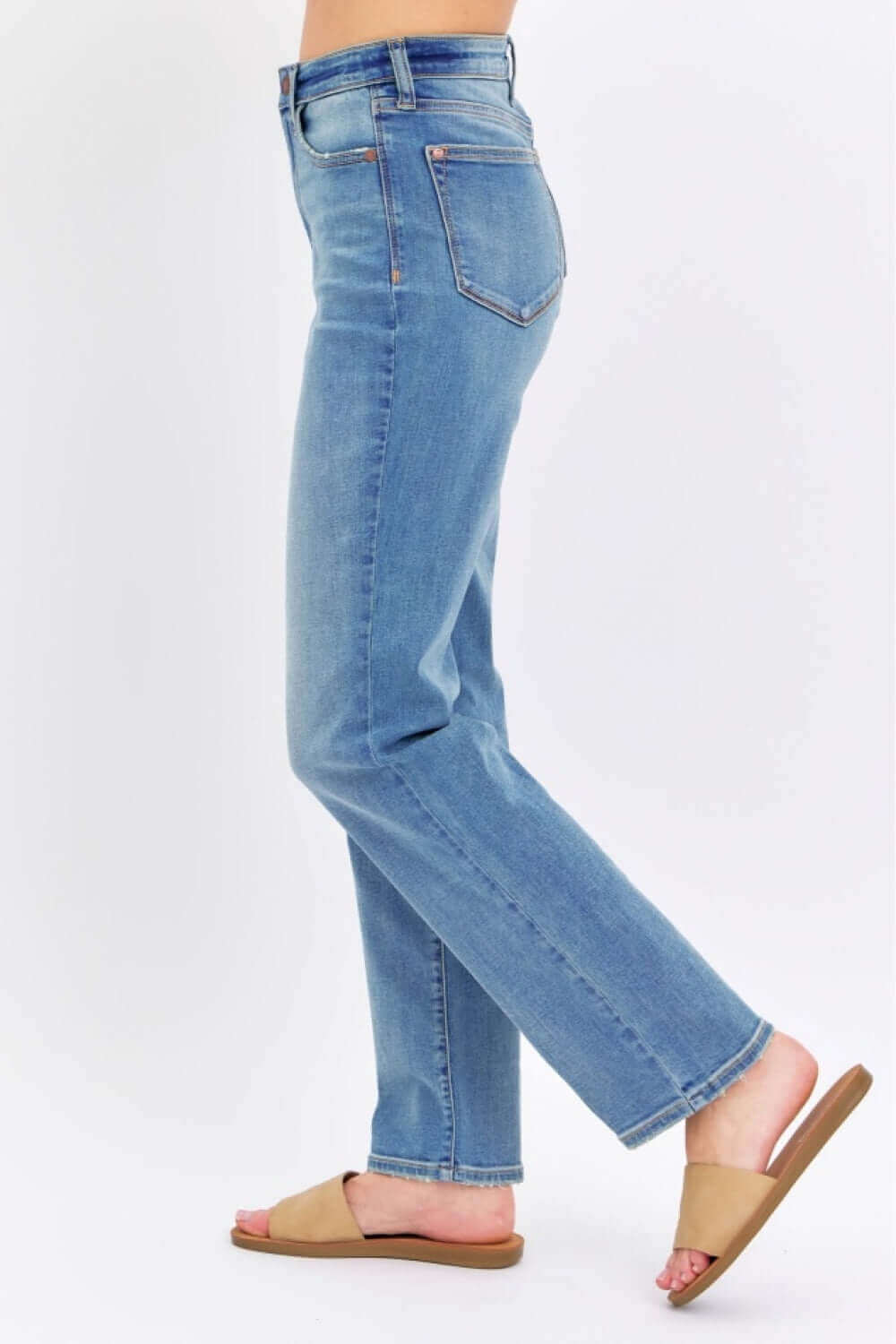 Side view of High Waist Straight Judy Blue Jeans with a classic straight leg cut, paired with casual sandals.