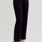 High-rise crop straight jeans with tummy control and elastic band, styled with chic white heels.