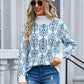 Stylish woman in Angel Wings Flower Turtleneck Sweater with floral pattern, jeans, and beret, exuding playful charm and elegance.