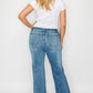 Woman wearing bytos Cat's Whiskers Mid Rise Bootcut Jeans from the back, showcasing a stylish bootcut design.